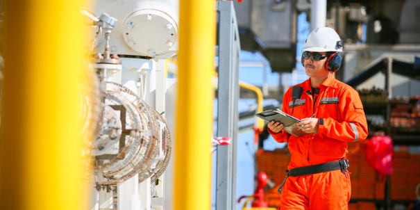 worker checking oil pipeline