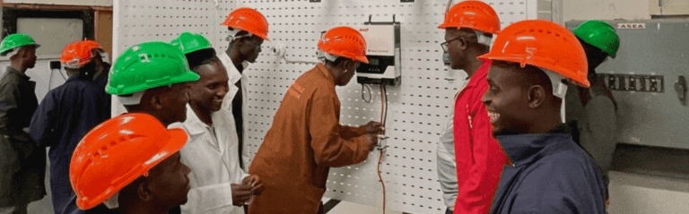 junior technicians learning how to install a photovoltaic solar panel